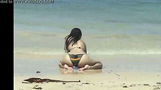 She Teases Her Curves on Caribbean Beach in Tiny Bikini