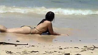 She Teases Her Curves on Caribbean Beach in Tiny Bikini