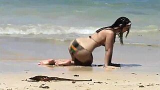She Teases Her Curves on Caribbean Beach in Tiny Bikini