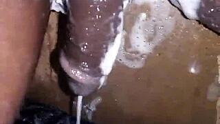 watch this 19yo boy's massive black cock get shaved smooth then stroked hard