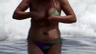 Wife flashes her huge tits and hairy pussy on crowded beach