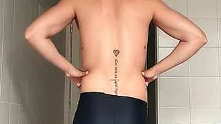 check out this sexy guy in black beach shorts hitting the bathroom for a close shave routine