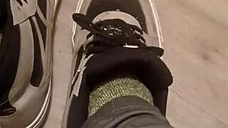 Friend trashes sneakers in playful foot adventure