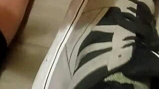 Friend trashes sneakers in playful foot adventure