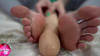 girl's neat legs give sensual footjob with huge dildo!!