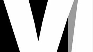 this young blonde czech beauty sits on the sofa casually sketching her artwork with focus