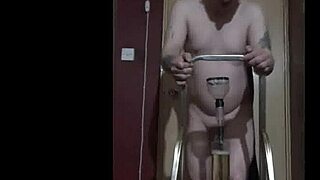 bisexual guy climbs ladder naked to fill and sip his own bottle