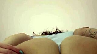 Watch this hot brunette milf shake her massive curvy ass and big tits like a total domme!