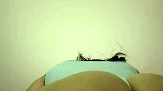 Watch this hot brunette milf shake her massive curvy ass and big tits like a total domme!