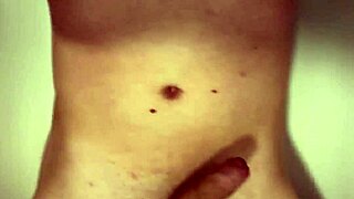 Naked babe spreads legs pees in bathtub stroking hard cock closeup wet