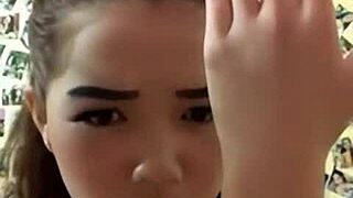 Sexy Asian big tits beauty strips and teases