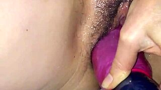 shoves fake cock deep into swollen pussy fisting toy play