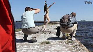 Naked beauty teases on the dock in public