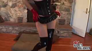 audrey hollander shoves toy deep wearing red gloves and leather corset