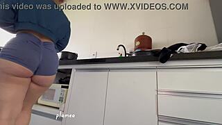 latina big ass squeezes into tight shorts softcore tease