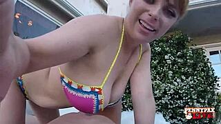 Redhead Penny Pax sunbathes outdoors flashing big clit pussy lips tits