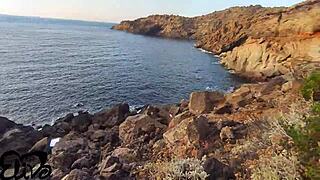 Cliffside Tease Reveals Curves During Seaside Oral Play