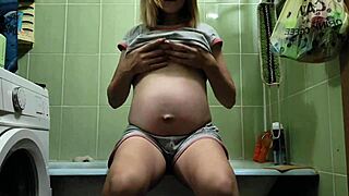 Late Pregnant Blonde Masturbates Shaved Pussy and Ass in Bathroom