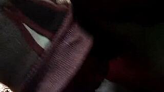 in the dark, she deepthroats his cock passionately