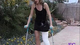 Fetisch-concept com punishes blonde teen in cast leg on stairs and outdoors