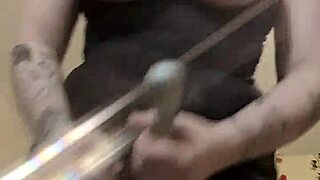 She strokes her thick strap-on while teasing her juicy squirting pussy