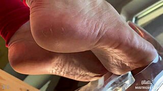 she dangles see-through high heels on wrinkled bare feet up close for foot fetish tease