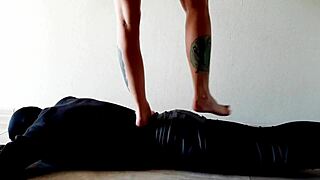 Dominatrix Nika Tramples Her Slave's Belly with Feet Stomach Press Fetish