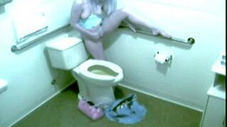 Intriguing Hidden Cam Catches Cute Blonde Fingering in Public Outdoors