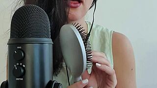 long-haired german teen brushes hair then shoves it deep into wet shaved pussy close-up