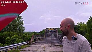 mysterious busty woman on deserted bridge