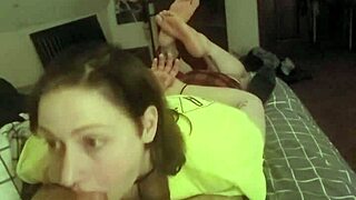 how's this redhead slave laying stomach-down deepthroating cock?