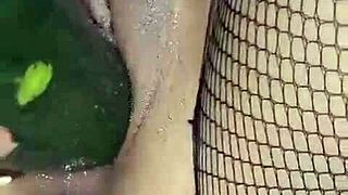 colombian milf squirts hard shoving cucumber deep in wet pussy