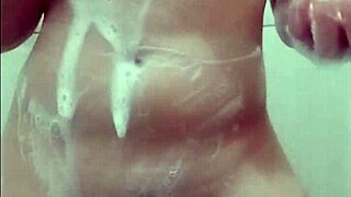 Holy shit, hot young babe soaps up her naked body in steamy shower play!