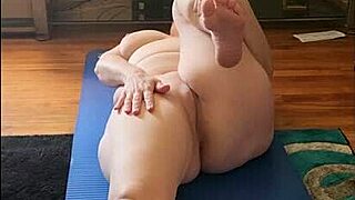 Vee flows through naked yoga poses flashing her saggy natural tits and bare pussy