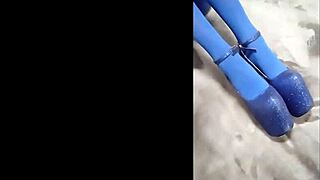 Sexy babe slips into pantyhose with blue high heels