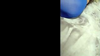 Sexy babe slips into pantyhose with blue high heels