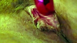 her clit buzzes wildly under vibrator as fingers tease deep