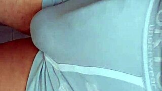 Guy's hard cock bulges in tight outdoor shorts