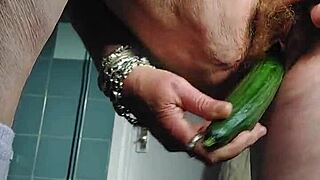 granny stuffs cucumber deep into her hairy german beaver on camera.