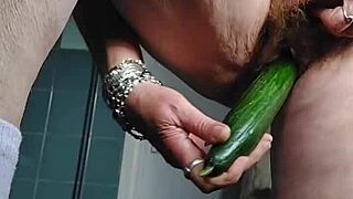 granny stuffs cucumber deep into her hairy german beaver on camera.