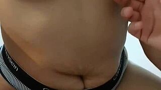 her navel feels so soft under my fingers while i stroke myself as she pleasures her own body