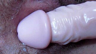 what happens when huge dildo pounds this dripping hairy pussy up close?