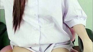 Asian Schoolgirl Uniform Masturbates with Glass Dildo On Camera