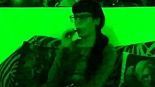 beth kinky goth teen mistress smokes seductively in green hd glow