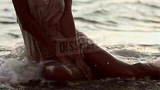 russian blonde in wet see-through bra on salty beach