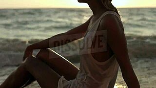 russian blonde in wet see-through bra on salty beach