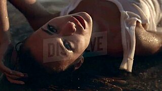 russian blonde in wet see-through bra on salty beach