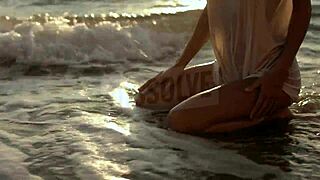 russian blonde in wet see-through bra on salty beach