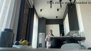 Sexy fit brunette does housework without panties