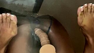 Ebony takes dildo deep in her pussy